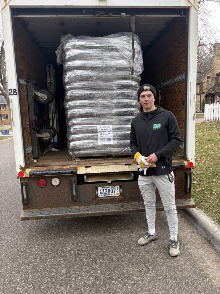 SOTA Lawn crew loading mulch for a job